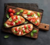 Bruschetta of old tomatoes and fresh basil
