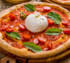 Pizza at burrata, cherry tomatoes and rocket
